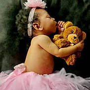 Azari is registered to the contest to win money with this photo: baby, sleeping, tutu, pink, headband, flower, teddy_bear, plush_toy, child, cute, peaceful, portrait, infant, soft_background, adorable, side_profile, resting, hugging, young_child, serene