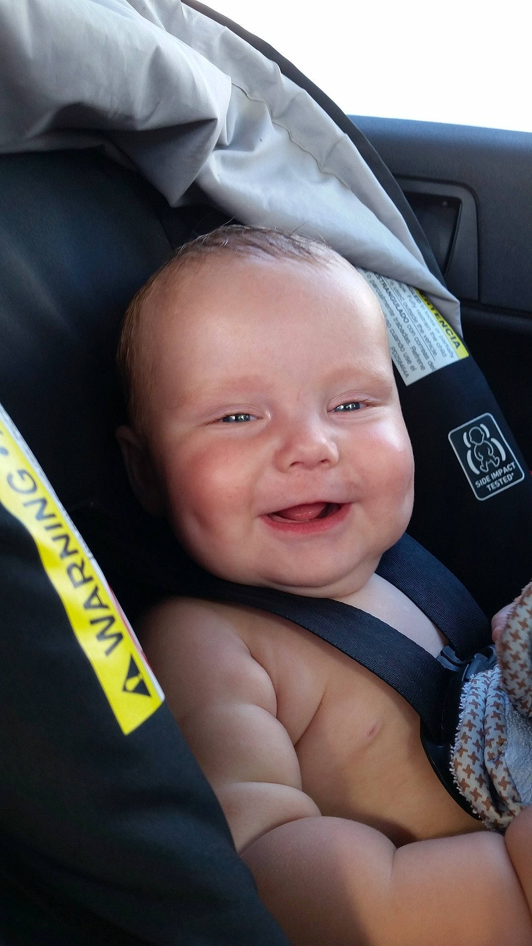 Tazz is registered to the contest to win money with this photo: blue, boy, cheek, child, cool, day, eye, face, forehead, fun, hand, head, infant, mouth, person, product, sitting, skin, smile, toddler