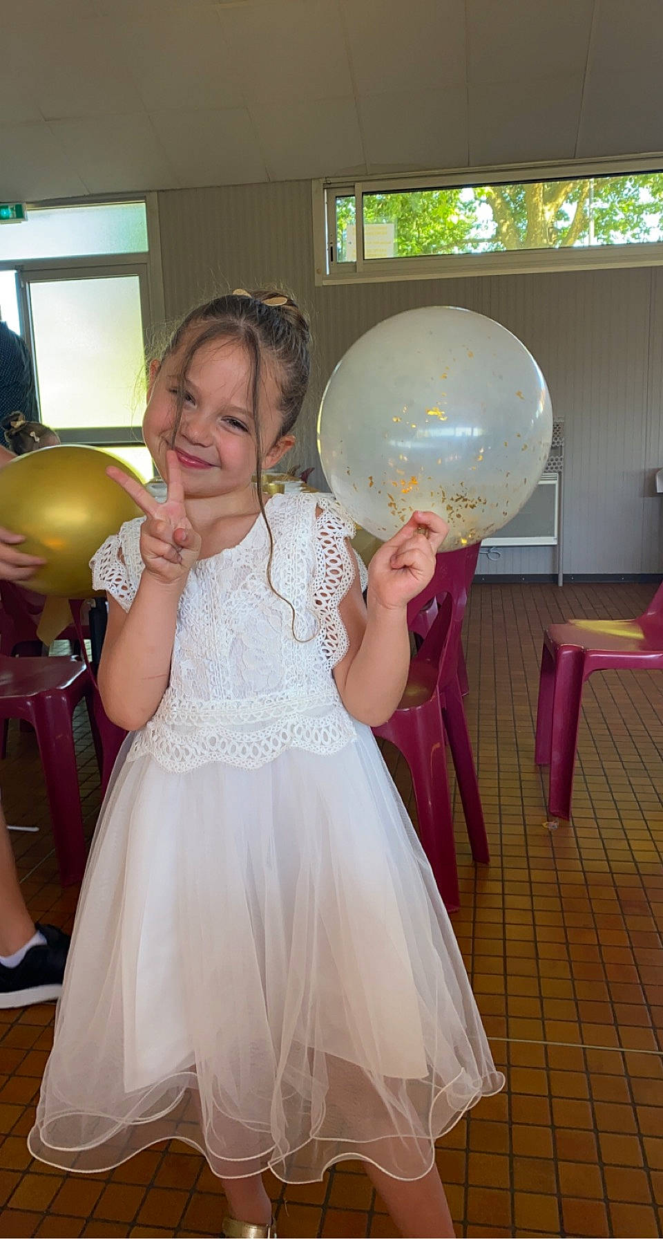 Aliyah participe au concours pour gagner de l'argent avec cette photo : ball, balloon, bridal_accessory, bridal_clothing, child, dress, event, facial_expression, finger, flooring, formal_wear, fun, gown, happy, joy, person, pink, shoulder, smile, standing