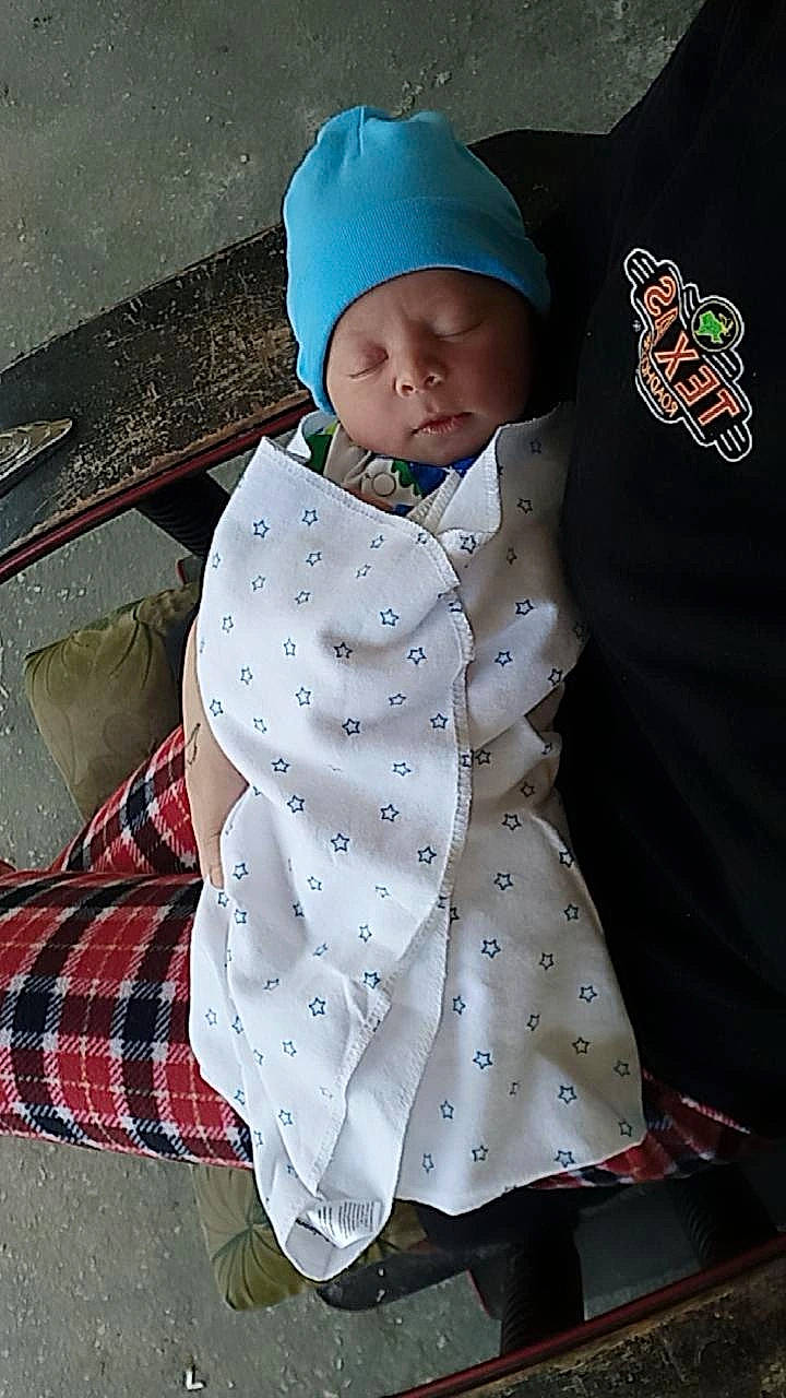 Josiah is registered to the contest to win money with this photo: baby, baby_products, baby_sleeping, baby_toddler_clothing, baseball_cap, cap, child, collar, comfort, headgear, headwear, knit_cap, linens, pattern, person, plaid, sleeve, t_shirt, tartan, textile
