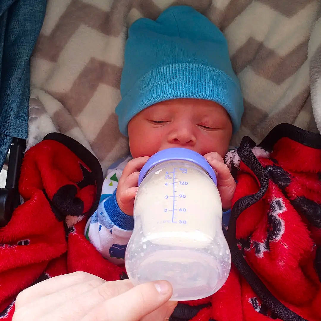 Josiah joined the competition — help win amazing prizes! baby, baby_bottle, baby_sleeping, baby_toddler_clothing, cheek, child, comfort, drinkware, electric_blue, finger, headwear, health_care, helmet, mouth, nail, person, plastic_bottle, product, service, skin