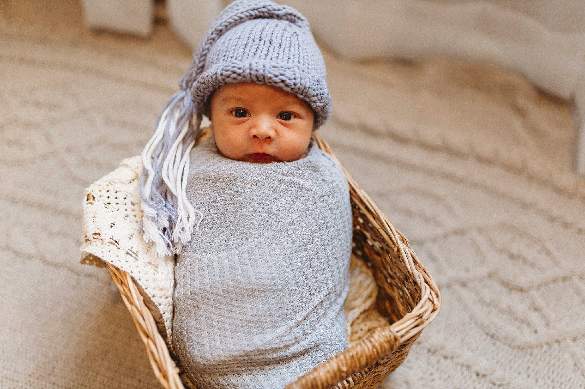 Braysen joined the competition — help win amazing prizes! baby, baby_toddler_clothing, cap, cheek, child, comfort, eye, face, fashion_accessory, headgear, headwear, human_body, knit_cap, linens, person, sitting, skin, sleeve, toddler, wood