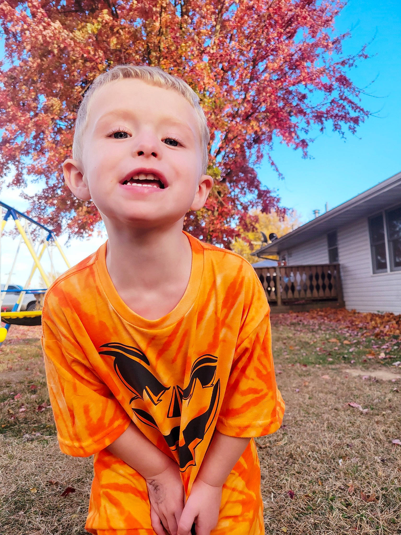 Bryce joined the competition — help win amazing prizes! child, chin, clothing, eye, fun, grass, happy, head, leisure, orange, people_in_nature, person, plant, sky, smile, soil, t_shirt, toddler, tree, twig