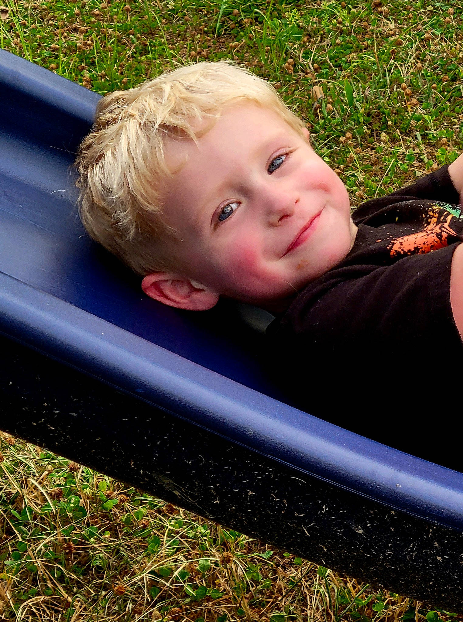 Bryce joined the competition — help win amazing prizes! baby_toddler_clothing, child, face, fun, garden, grass, hair, happy, joy, lawn, leaf, leisure, people_in_nature, person, plant, play, recreation, sitting, smile, toddler