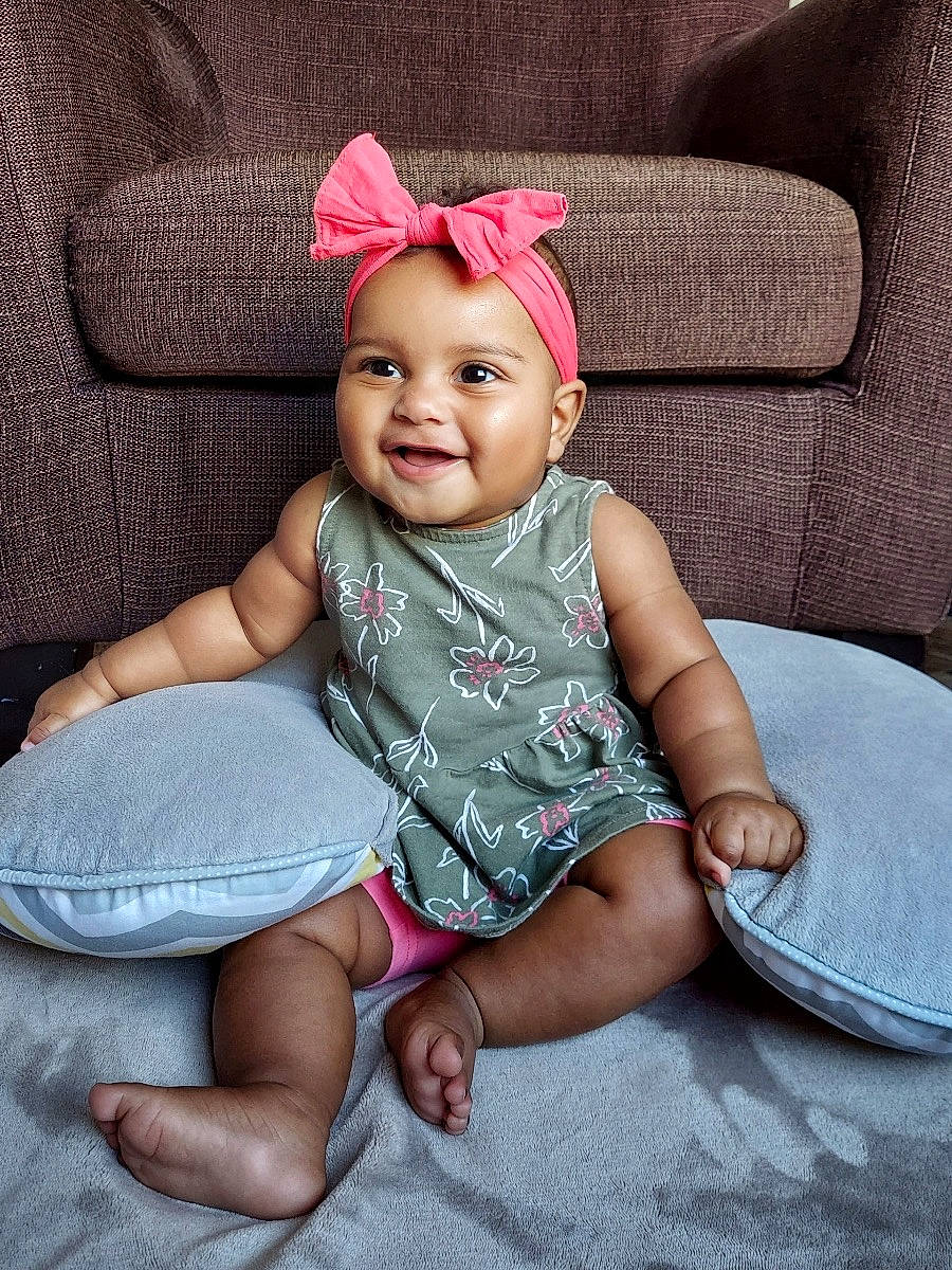 Naissa is registered to the contest to win money with this photo: baby, baby_toddler_clothing, child, chin, comfort, eye, face, fun, happy, headgear, headwear, joy, magenta, pattern, person, pink, product, purple, skin, sleeve