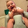 baby, child, infant, foam_chair, indoor, carpet, clothing, smiling, hands, face, foot, playful, happy, person, seat, cute, toddler, skin, expression, young