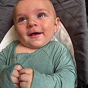 River joined the competition — help win amazing prizes! baby, infant, smile, face, hands, green_clothing, baby_seat, cute, child, portrait, happy, closeup, indoor, skin, eyes, expression, young_child, sitting, cozy, candid