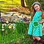 Rosemary joined the competition — help win amazing prizes! child, girl, green_dress, shamrock, purse, headband, boots, garden, flowers, daffodils, grass, rocks, sunlight, smile, posing, nature, outdoor, happy, spring, plant