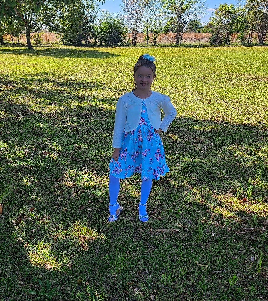 Isabella is registered to the contest to win money with this photo: electric_blue, field, fun, grass, grassland, happy, hat, joy, landscape, lawn, meadow, natural_landscape, pasture, people_in_nature, person, plain, plant, prairie, sky, tints_and_shades