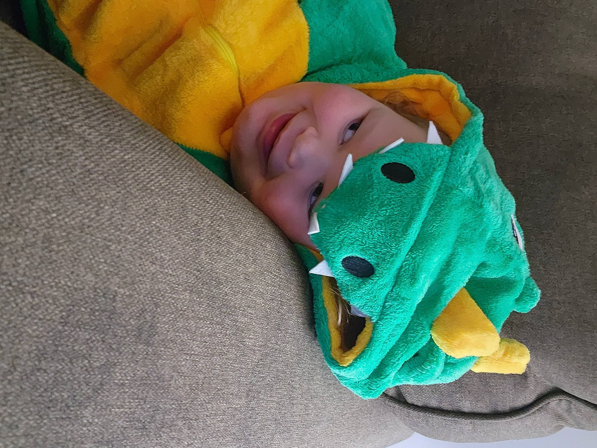 Jessie is registered to the contest to win money with this photo: art, baby, baby_toddler_clothing, bedtime, blanket, carmine, child, comfort, electric_blue, fashion_accessory, flooring, grass, headwear, joy, linens, pattern, person, room, textile, toddler