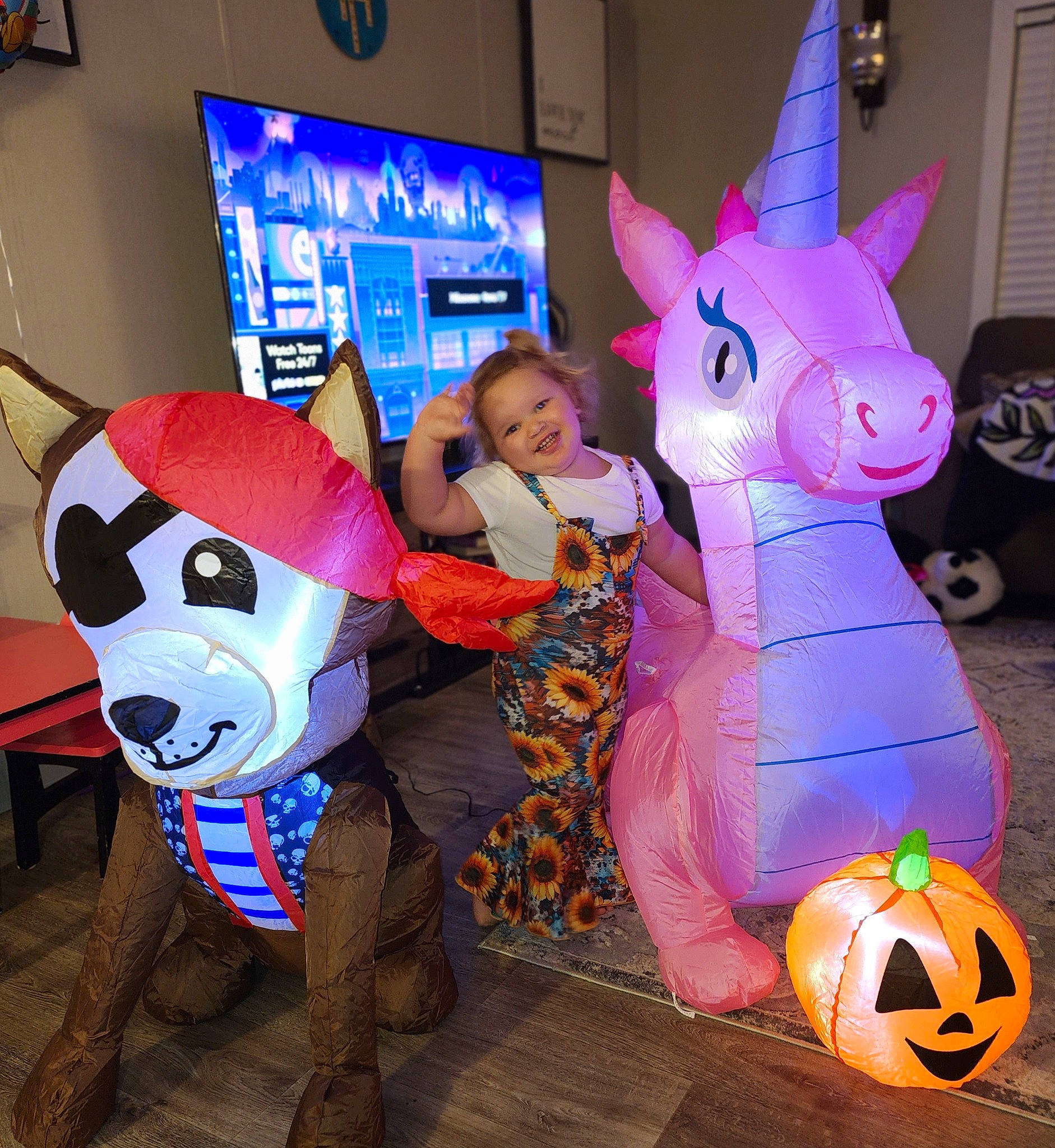 Jessie is registered to the contest to win money with this photo: animation, art, ball, blue, calabaza, event, fictional_character, fun, games, inflatable, joy, mammal, mythical_creature, party_supply, person, pumpkin, purple, recreation, snapshot, television