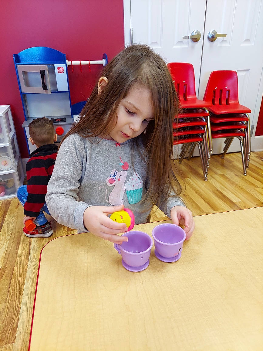 Calista joined the competition — help win amazing prizes! chair, child, event, flooring, fun, hardwood, home_appliance, kindergarten, kitchen_appliance, leisure, person, play, room, sitting, t_shirt, table, tableware, toddler, varnish, wood