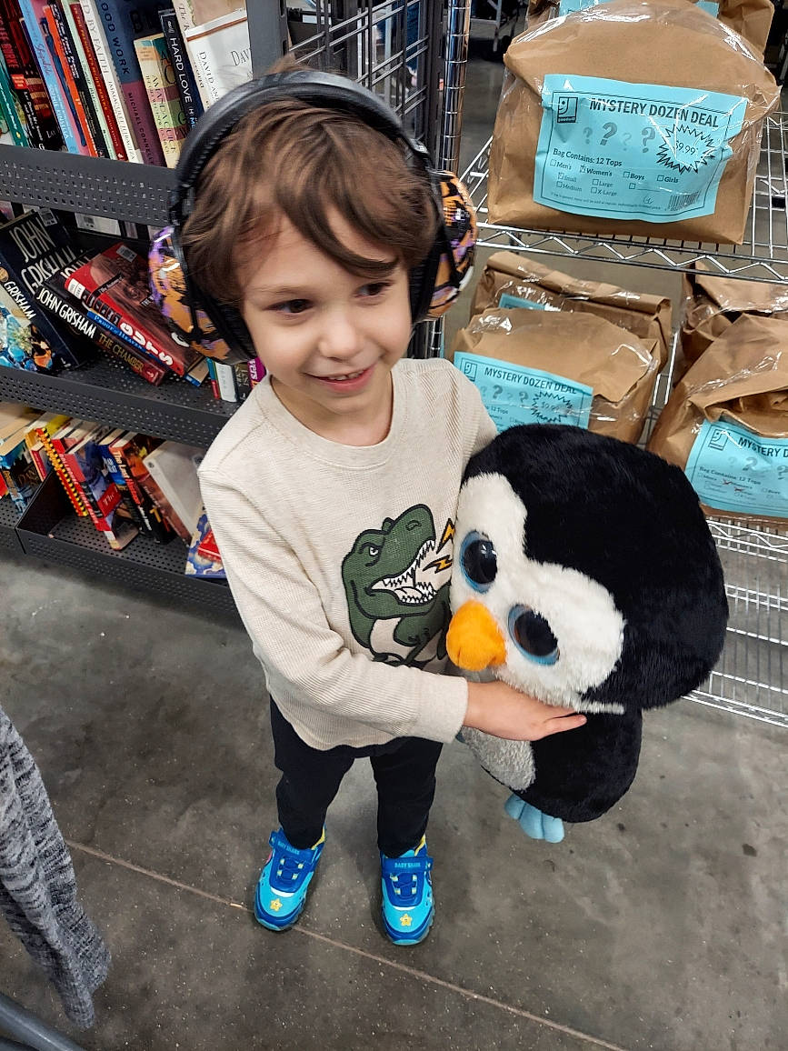 Sebastian joined the competition — help win amazing prizes! bookcase, child, fun, fur, happy, holiday, joy, leisure, panda, person, plush, retail, shelf, sitting, smile, sneakers, stuffed_toy, t_shirt, textile, toddler