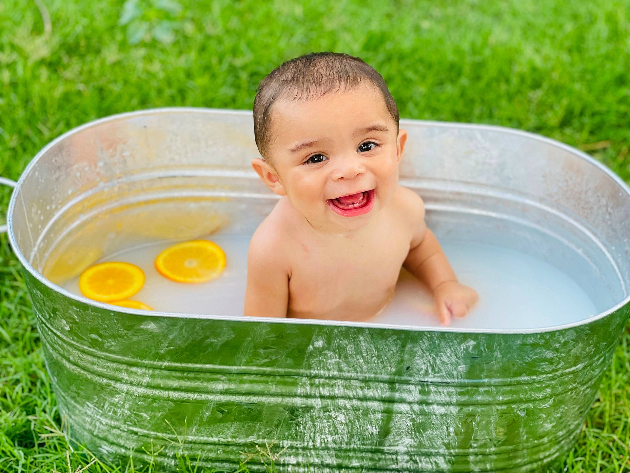 Augustus is registered to the contest to win money with this photo: baby, baby_bathing, baby_products, basket, bathing, bowl, child, circle, fun, grass, happy, joy, laugh, leisure, people_in_nature, person, plant, play, recreation, smile