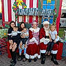 bench, celebration, child, children, christmas, costume, family, festive, garland, gift_box, holiday, mrs_claus, outdoor, people, portrait, santa_claus, seasonal, smile, tree, wreath