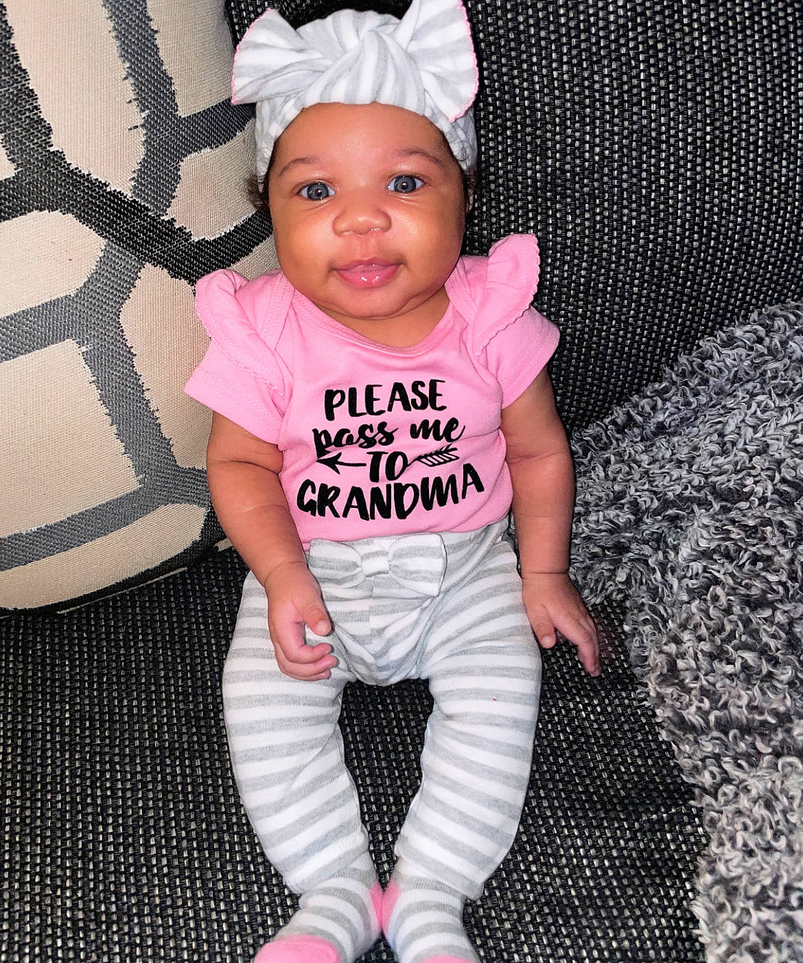 Averi joined the competition — help win amazing prizes! arm, baby, baby_toddler_clothing, cap, cheek, cool, eyelash, facial_expression, happy, head, headwear, leg, lip, magenta, pattern, person, pink, sleeve, t_shirt, textile