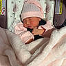 Kaylani joined the competition — help win amazing prizes! newborn, baby, sleeping, pink, hat, blanket, car_seat, floral_pattern, cozy, infant, child, soft, wrapped, cute, peaceful, resting, indoors, clothing, toddler, face