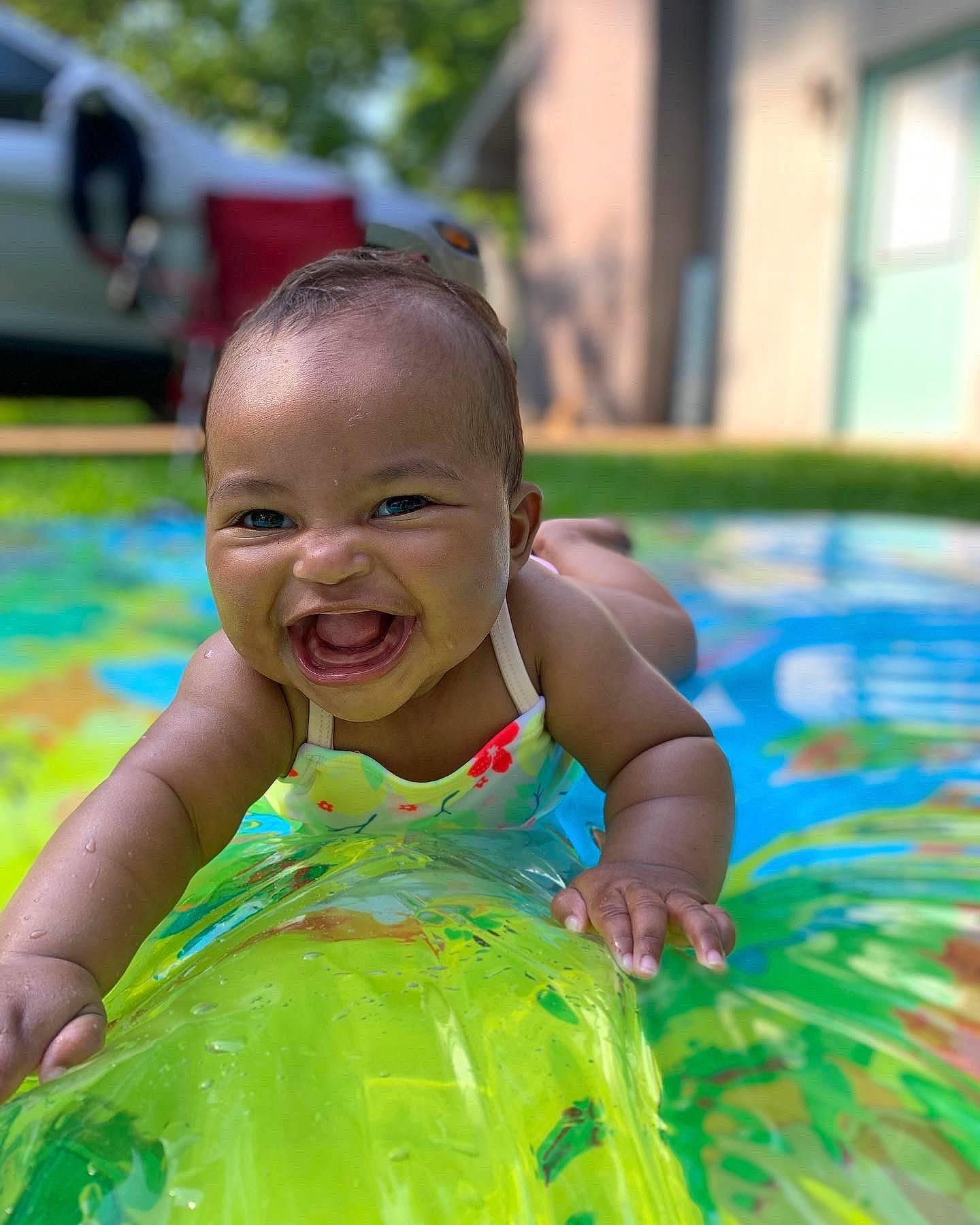 Jenna joined the competition — help win amazing prizes! baby, baby_toddler_clothing, bathing, child, event, face, fun, grass, happy, laugh, leisure, people_in_nature, person, play, recreation, sitting, smile, toddler, vacation, water