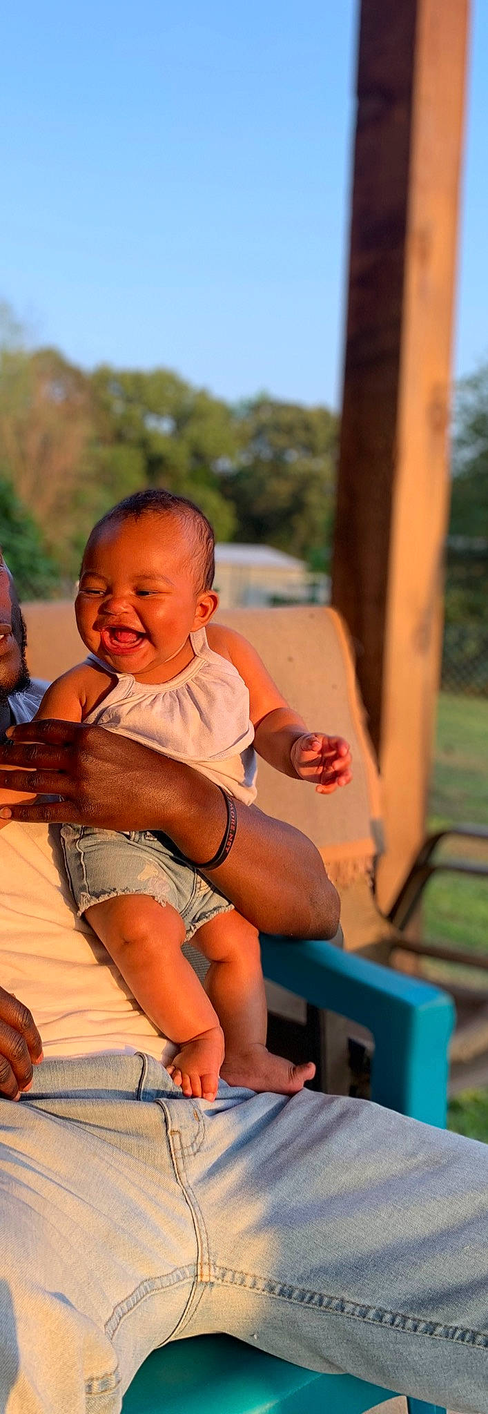 Jenna joined the competition — help win amazing prizes! abdomen, baby, barefoot, foot, fun, grass, happy, human_leg, lap, leisure, orange, person, shorts, skin, sky, smile, summer, thigh, toddler, tree