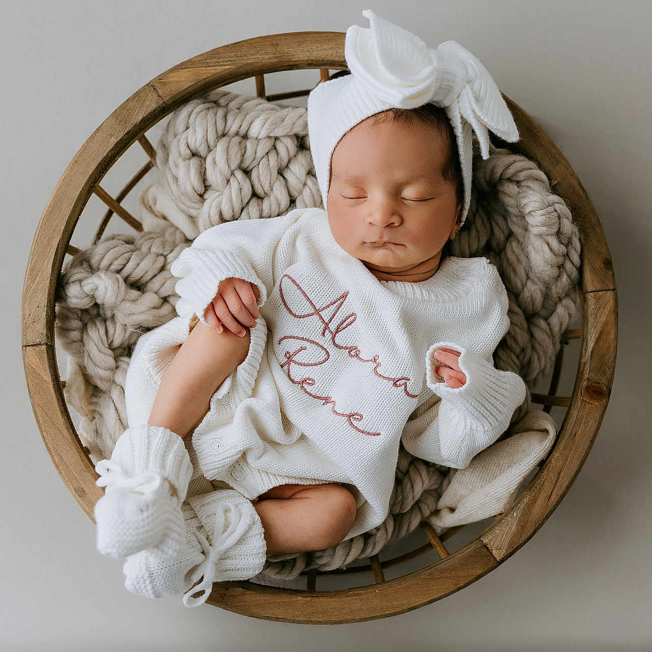 Alora-Rene joined the competition — help win amazing prizes! baby, basket, blanket, bow, cozy, cute, headband, indoors, infant, knitwear, newborn, peaceful, portrait, resting, sleeping, small_feet, small_hands, soft_lighting, white_clothing, wooden_basket