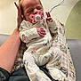 Arieanna joined the competition — help win amazing prizes! baby, bear_design, blanket, child, comfort, cute, floral_pattern, hand, hospital, human, indoor, infant, newborn, onesie, pacifier, person, resting, sleeping, soft_lighting, tattoo