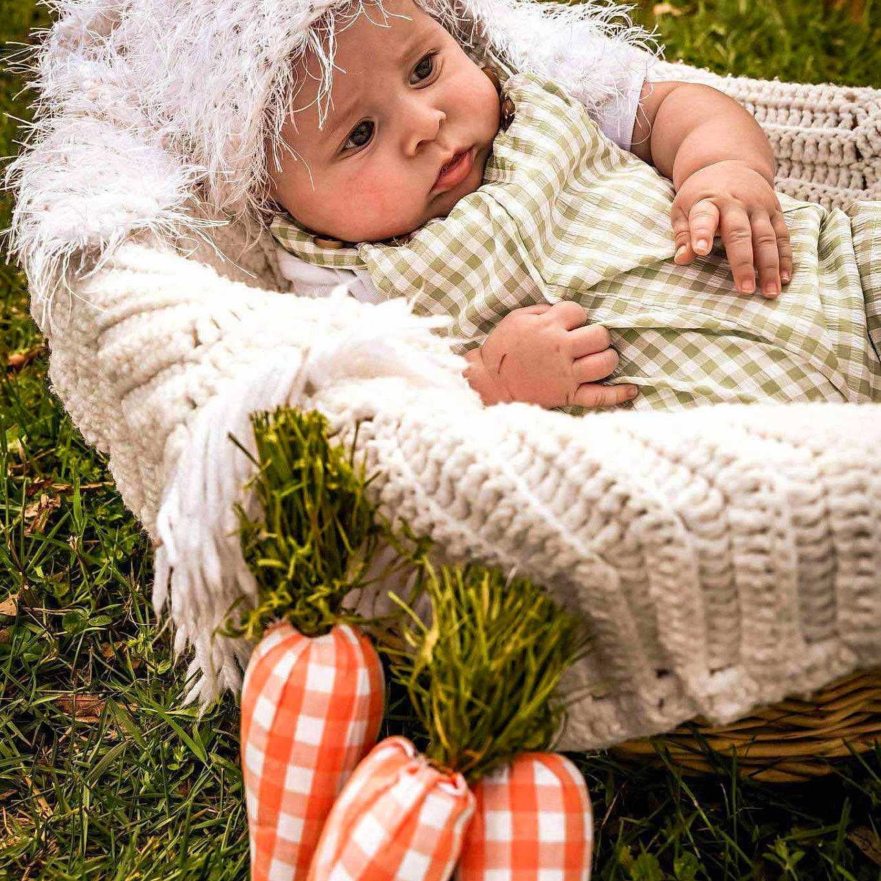 Liam joined the competition — help win amazing prizes! baby, blanket, bonnet, cap, clothing, face, furniture, grass, hat, head, hood, lawn, newborn, pants, person, photography, plant, portrait, quilt, sitting