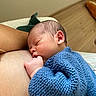 Marin a rejoint le concours — aidez-le/la à gagner de superbes lots ! arm, baby, blue_sweater, child, closeup, cozy, flooring, hand, indoors, infant, knitted, newborn, peaceful, person, portrait, rest, skin, sleeping, soft_lighting, wood_floor