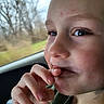 Landon is registered to the contest to win money with this photo: baby, bodypart, ear, eating, face, finger, food, hand, head, mouth, nail, person, photography, portrait, skin