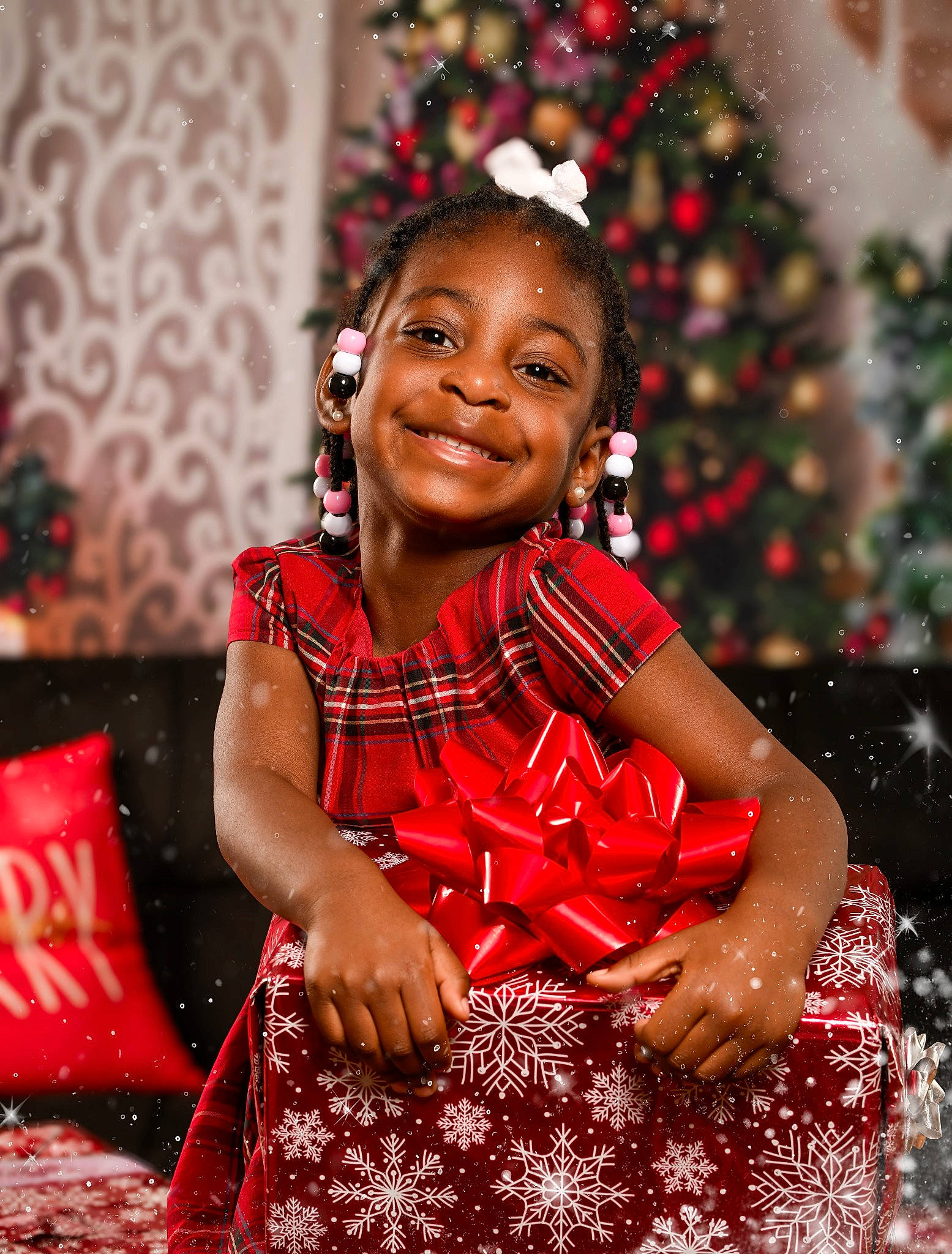 Kamirah is registered to the contest to win money with this photo: child, event, facial_expression, fashion_design, formal_wear, fun, hairstyle, happy, houseplant, jewellery, joy, laugh, magenta, ornament, pattern, person, portrait_photography, red, sitting, smile