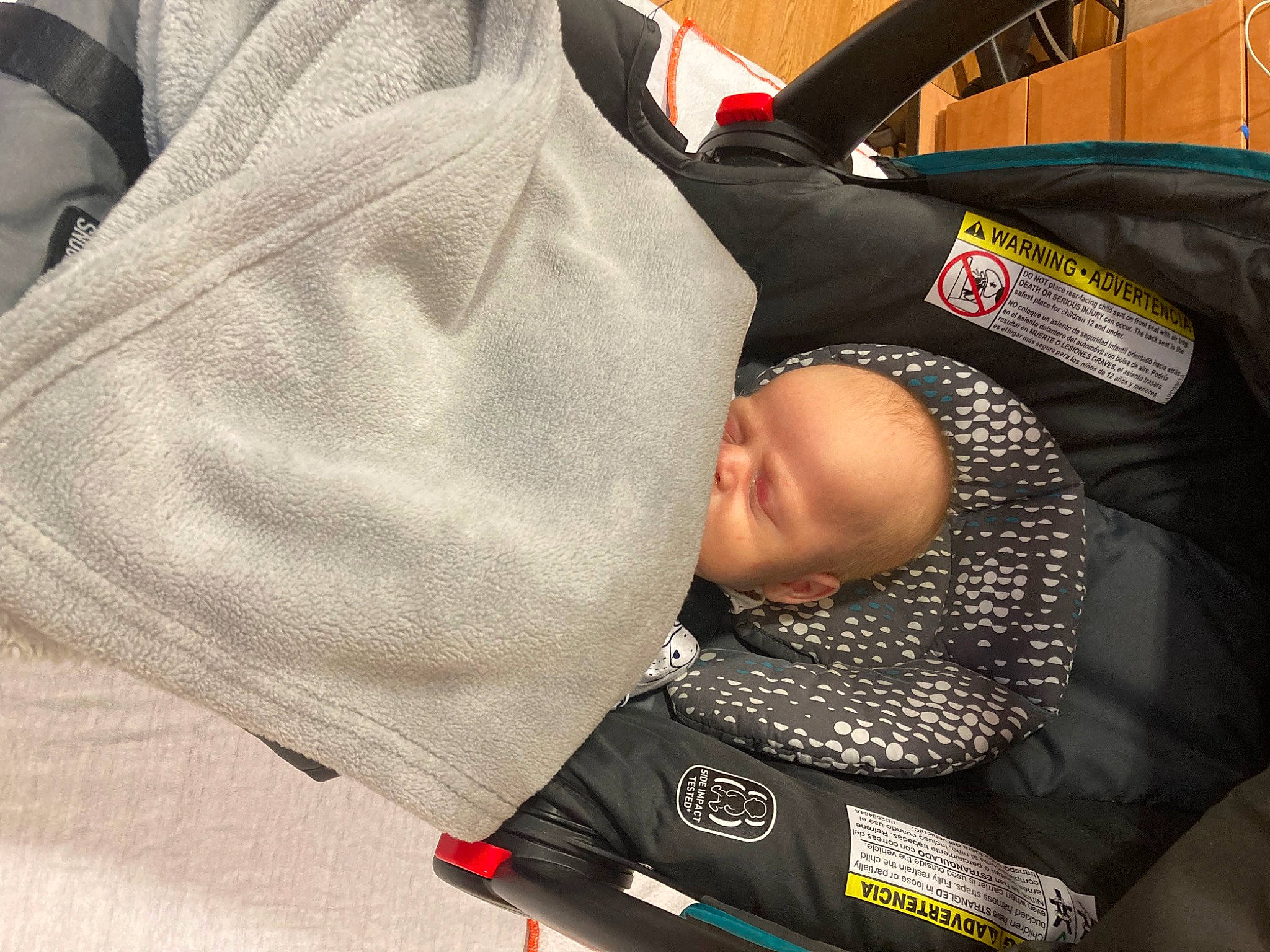 Michael is registered to the contest to win money with this photo: auto_part, automotive_design, automotive_tire, automotive_wheel_system, baby, baby_carriage, baby_products, car_seat, carmine, child, comfort, gesture, hat, motor_vehicle, person, personal_protective_equipment, rim, sleeve, suit, toddler