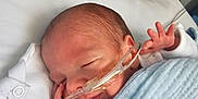 Rohan joined the competition — help win amazing prizes! newborn, baby, sleeping, hospital, nasal_tube, blanket, blue_blanket, infant, bed, medical, cute, face, peaceful, resting, child, healthcare, person, pediatric, soft, wrapped