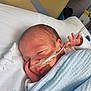 newborn, baby, sleeping, hospital, nasal_tube, blanket, blue_blanket, infant, bed, medical, cute, face, peaceful, resting, child, healthcare, person, pediatric, soft, wrapped