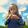 Timothy is registered to the contest to win money with this photo: child, dandelion, outdoor, blue_sky, clouds, grass, greenery, long_hair, curious, holding, flower, nature, daylight, casual_clothing, portrait, young, innocent, playful, tree, sunny