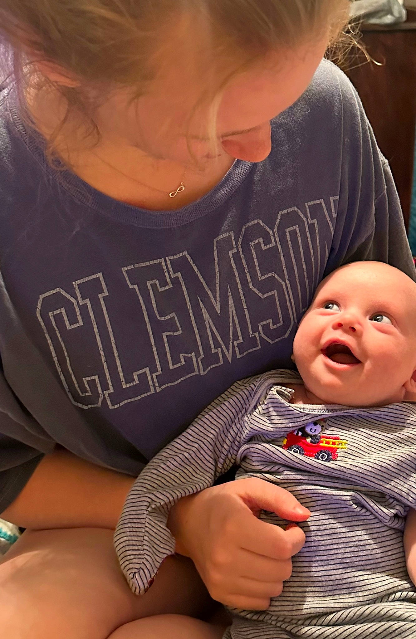 Jacob is registered to the contest to win money with this photo: baby, baby_toddler_clothing, cheek, child, comfort, eyelash, finger, fun, gesture, hand, happy, interaction, mouth, people, person, sharing, sitting, skin, sleeve, thigh