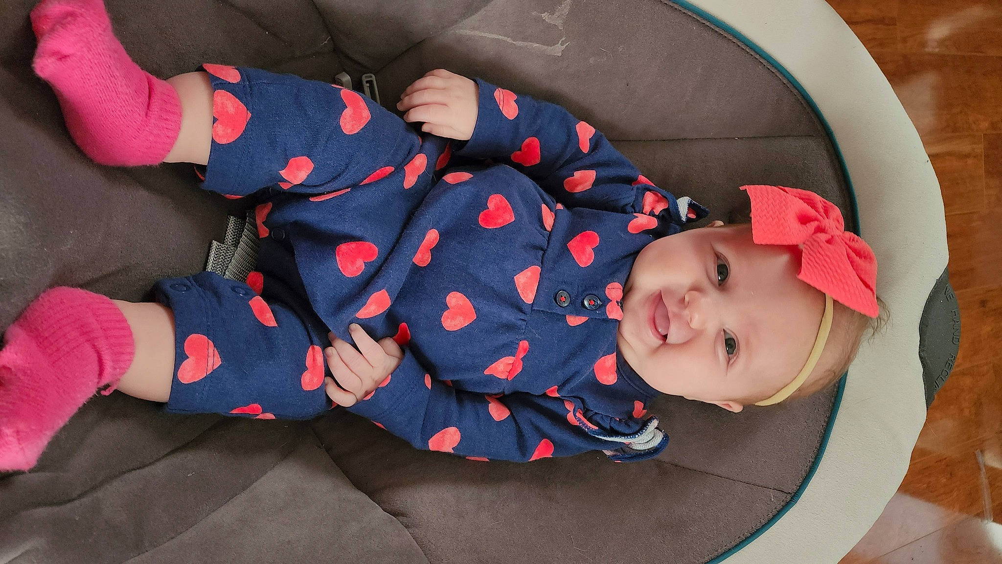 Kaisley is registered to the contest to win money with this photo: baby, baby_carriage, baby_products, baby_sleeping, baby_toddler_clothing, carmine, child, comfort, hat, headwear, lap, pattern, person, plant, product, sitting, sleeve, sock, sun_hat, textile