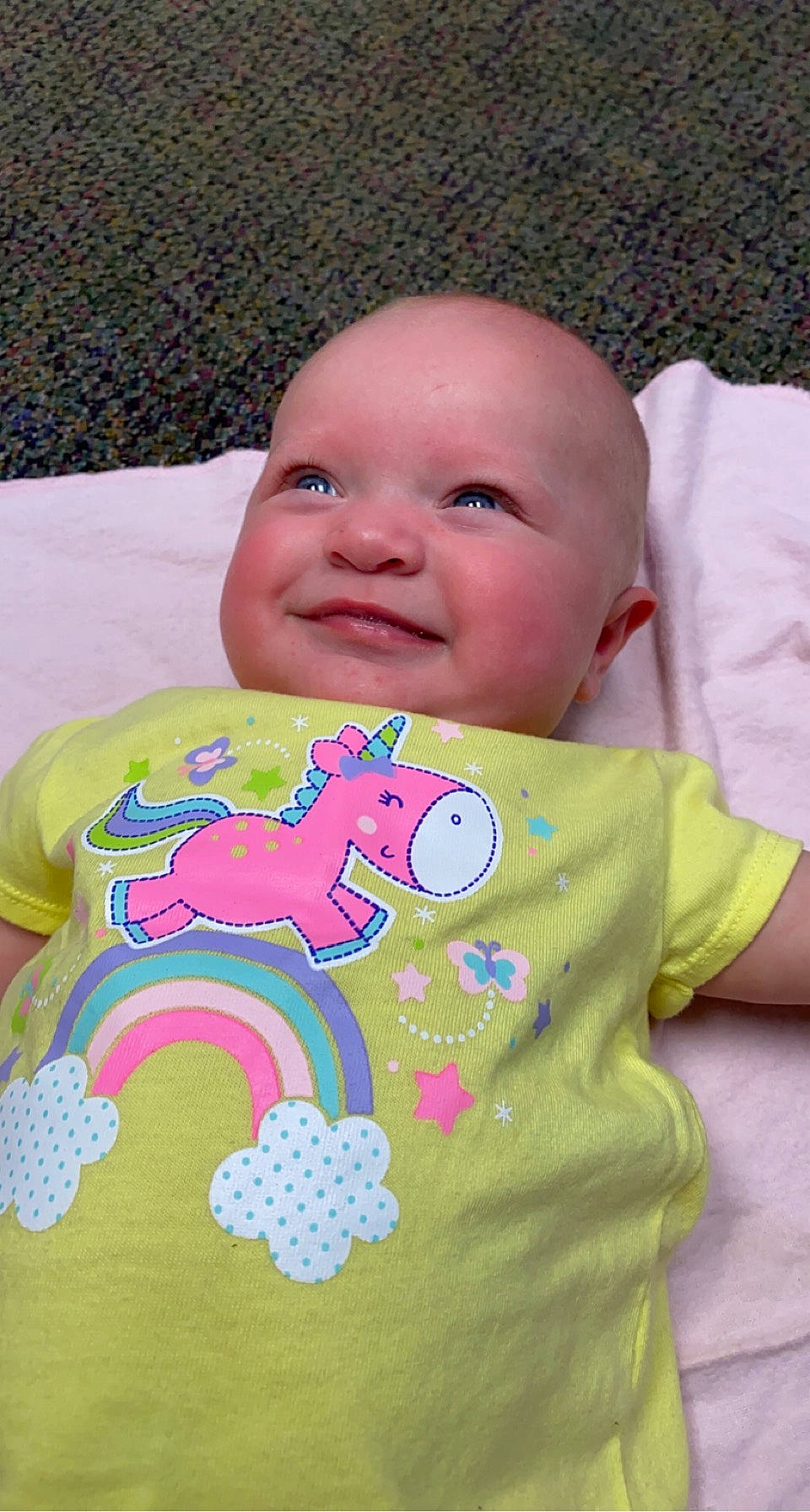 Emmula is registered to the contest to win money with this photo: art, baby, baby_products, baby_toddler_clothing, cheek, child, fun, grass, happy, joy, linens, magenta, pattern, person, pink, play, skin, sleeve, smile, t_shirt