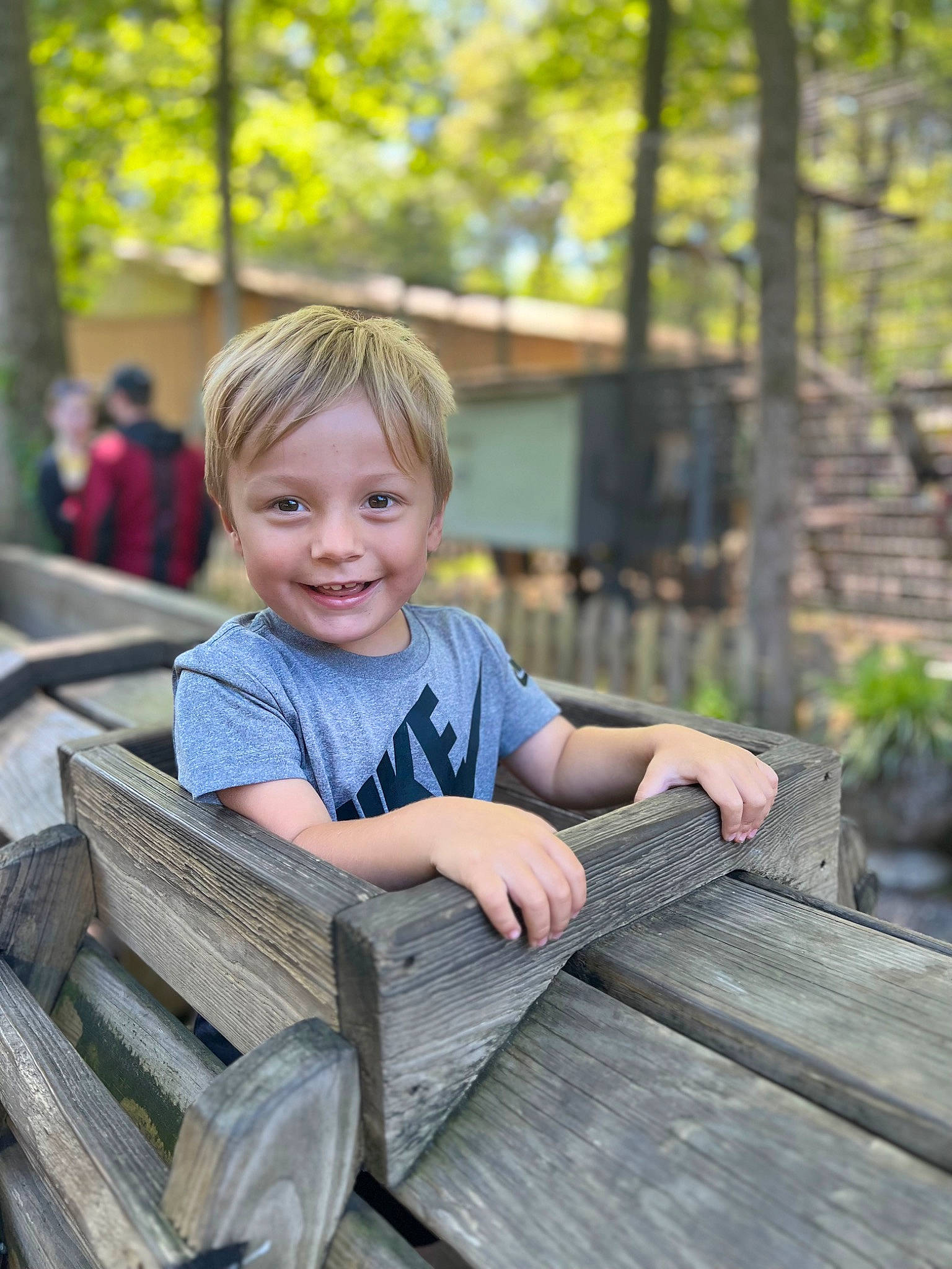 Jamie is registered to the contest to win money with this photo: blond, child, denim, fun, grass, happy, joy, leisure, outdoor_furniture, person, plant, portrait_photography, reading, recreation, sitting, smile, t_shirt, toddler, tree, vacation