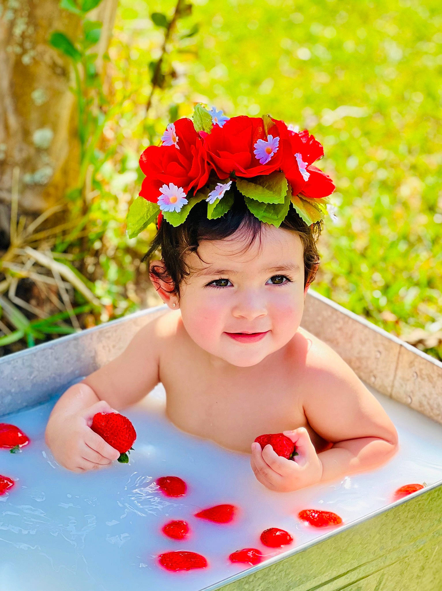 Georgina is registered to the contest to win money with this photo: baby, baby_laughing, baby_toddler_clothing, child, flower, fun, goggles, grass, happy, headwear, joy, leisure, magenta, people_in_nature, person, petal, pink, plant, play, recreation