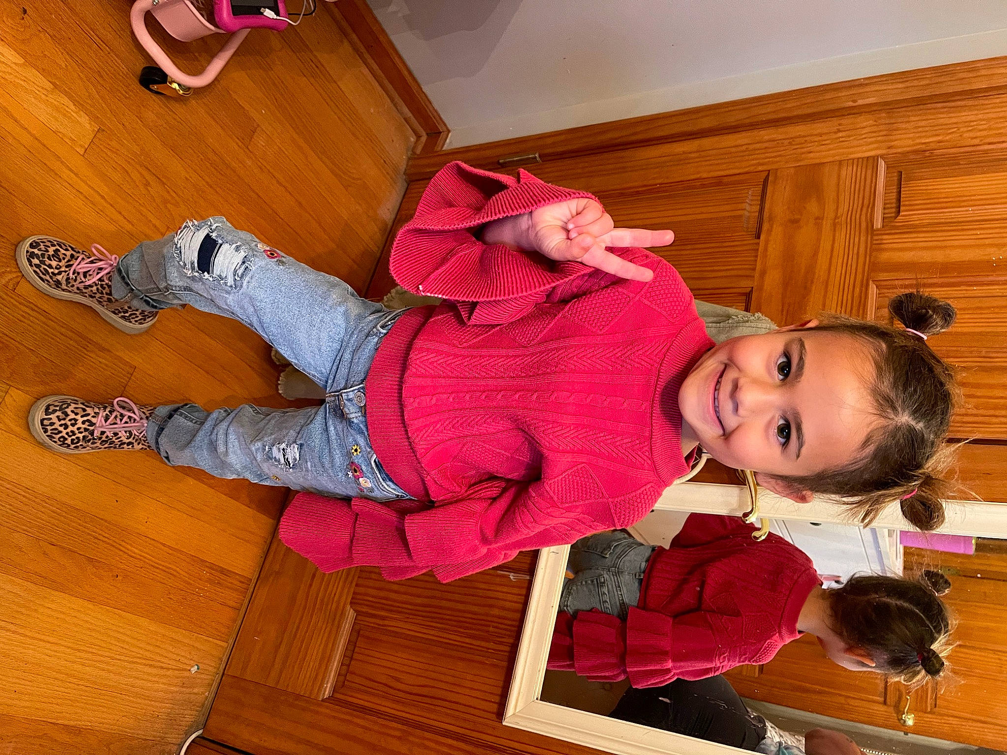 Aria joined the competition — help win amazing prizes! baby_toddler_clothing, child, floor, flooring, foot, happy, hardwood, human_leg, joy, knee, pattern, person, pink, red, sleeve, smile, toddler, varnish, walking_shoe, white
