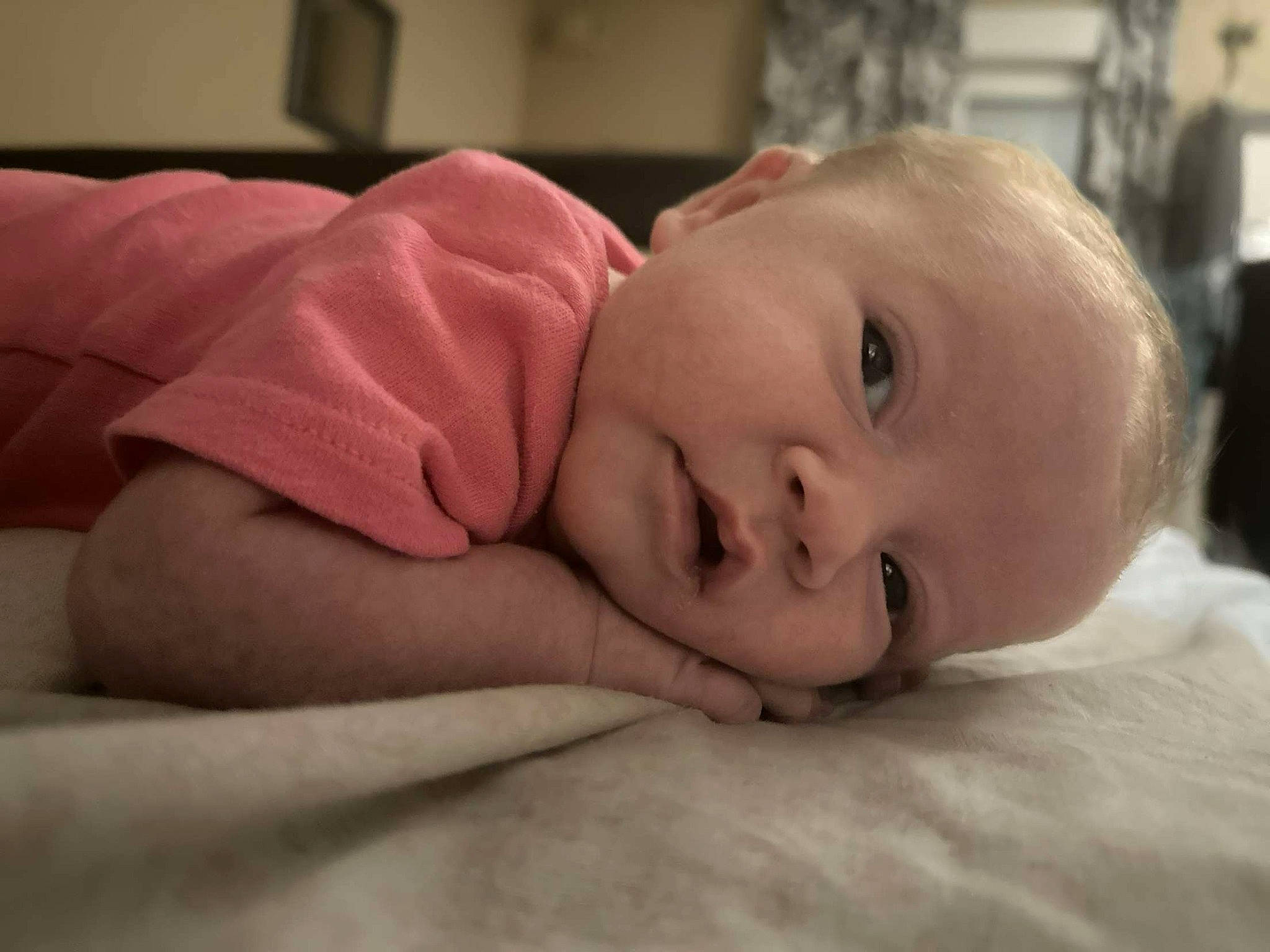 Mya participe au concours pour gagner de l'argent avec cette photo : baby, cheek, child, comfort, eyebrow, flash_photography, flooring, fur, happy, iris, linens, lip, nose, person, portrait_photography, room, sitting, skin, smile, toddler