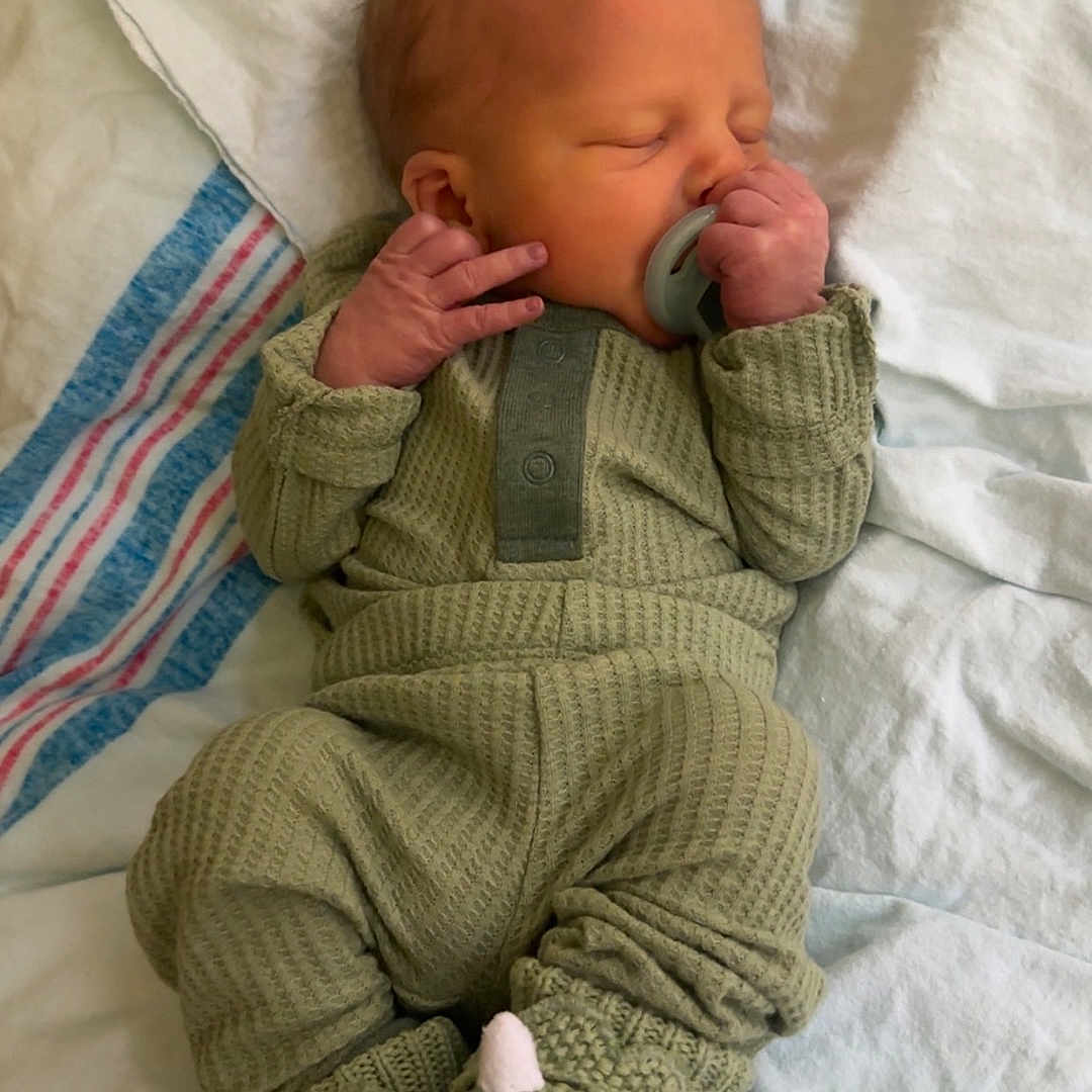 Gunther joined the competition — help win amazing prizes! baby, bed, blanket, bodypart, clothing, couch, cushion, face, finger, furniture, glove, hand, head, homedecor, knitwear, newborn, person, photography, portrait, sweater