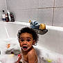toddler, bath, bubble, soap, water, toy, curly_hair, child, bathtub, bathroom, foam, happy, playful, skin, face, person, cleaning, sitting, indoor, cute