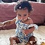 Reign joined the competition — help win amazing prizes! toddler, cake, messy, child, curly_hair, face, hands, legs, blue_and_white_outfit, sitting, frosting, crumbs, home, cushion, blanket, cute, flower_clip, soft_surface, indoors, playful