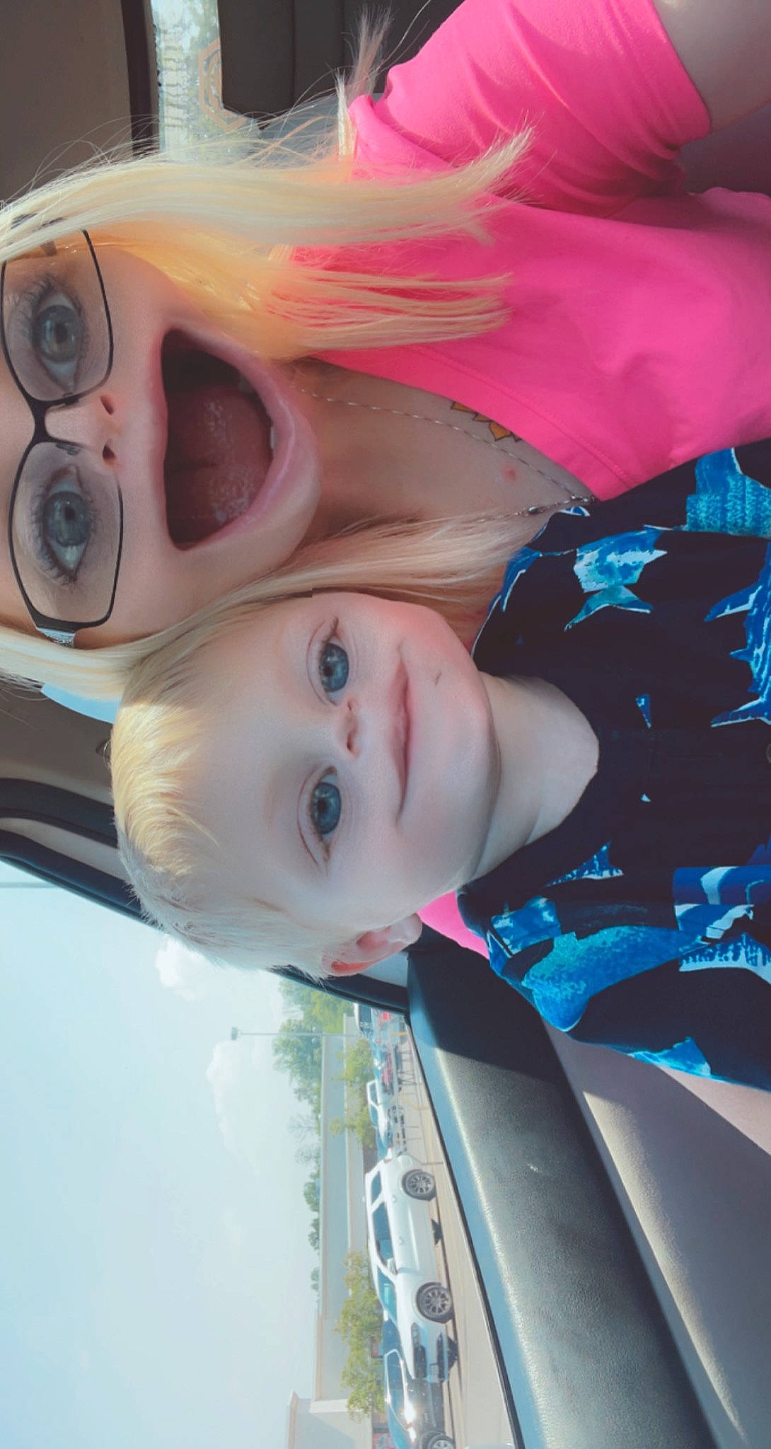 Brantley is registered to the contest to win money with this photo: automotive_design, car, chin, cool, eye, eyebrow, eyelash, fun, happy, hat, headgear, jaw, lip, mouth, nose, person, pink, skin, smile, tree