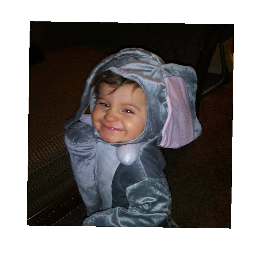 Boston is registered to the contest to win money with this photo: baby, bonnet, child, ear, head, headgear, hood, joy, outerwear, person, smile, toddler