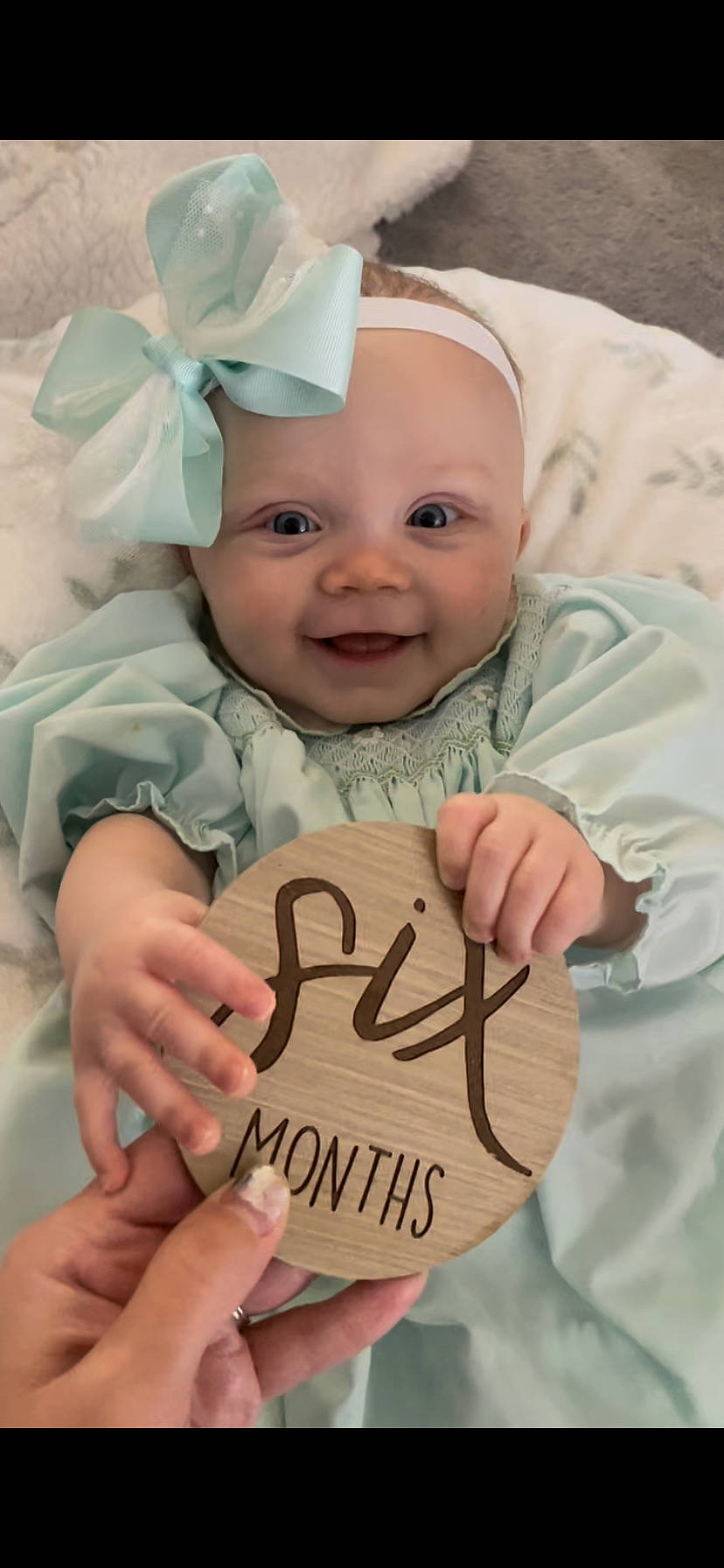 Emmy is registered to the contest to win money with this photo: baby, baby_toddler_clothing, cap, cheek, child, eye, face, facial_expression, finger, fun, gesture, happy, head, headwear, joy, people, person, pink, skin, smile