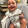 Apolo joined the competition — help win amazing prizes! baby, smiling, high_chair, happy, infant, child, seat, straps, indoors, person, cute, skin, clothing, furniture, portrait, young_child, baby_face, expression, sitting, closeup