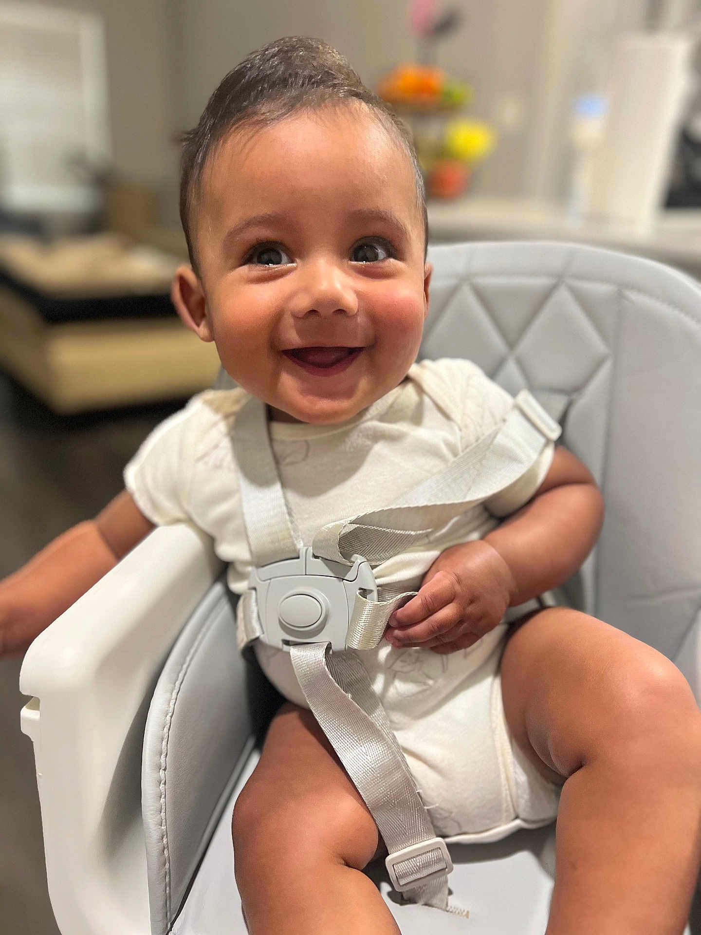 Apolo joined the competition — help win amazing prizes! baby, smiling, high_chair, straps, happy, child, indoor, infant, cute, seat, person, sitting, clothing, face, hand, leg, skin, home, furniture, bright