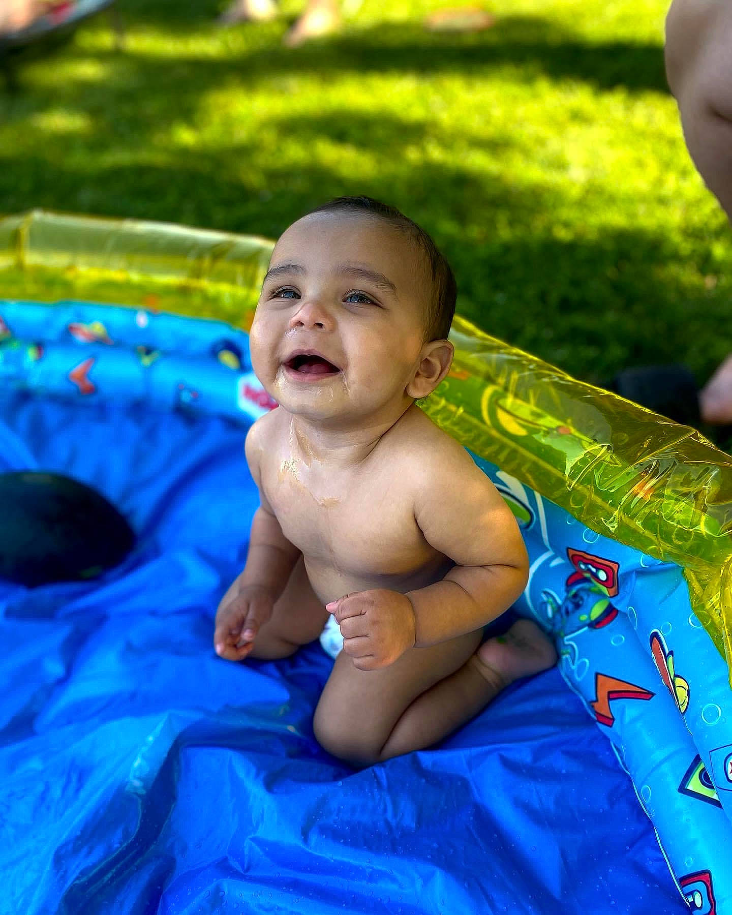 Desmond joined the competition — help win amazing prizes! baby, barechested, bathing, body_of_water, child, electric_blue, event, fun, garden, grass, happy, leisure, people_in_nature, person, play, recreation, sitting, smile, toddler, vacation
