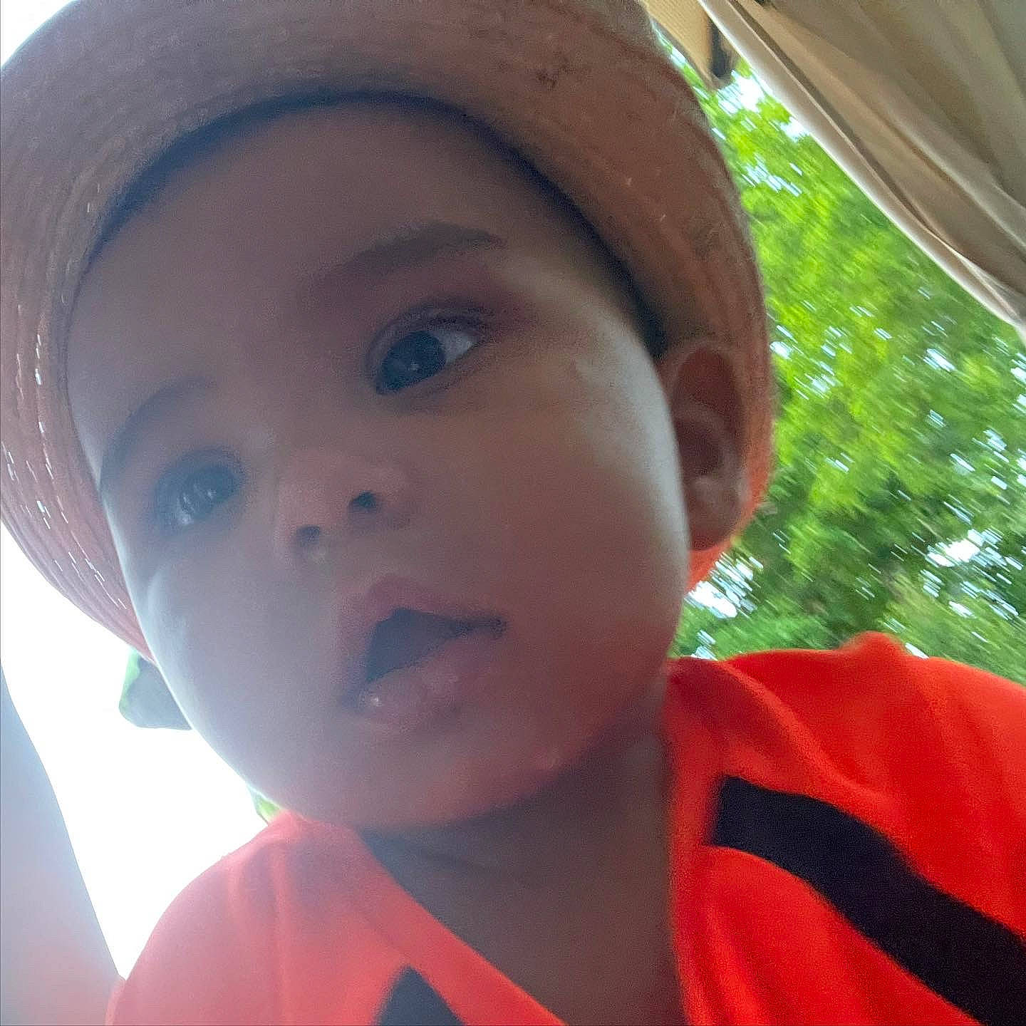 Desmond is registered to the contest to win money with this photo: baby, baseball_cap, cap, eyebrow, eyewear, fun, happy, hat, headgear, helmet, leisure, lip, mouth, nose, person, personal_protective_equipment, recreation, skin, sun_hat, toddler